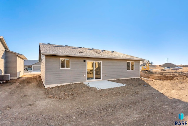 rear view of property with a patio and cooling unit