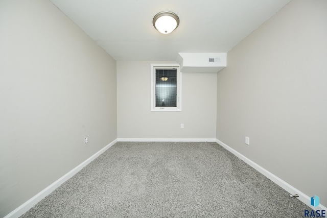 unfurnished room featuring carpet flooring