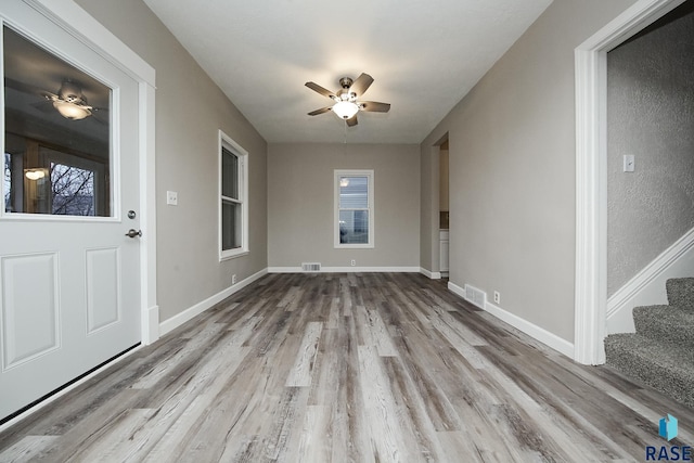 interior space featuring ceiling fan and light wood-type flooring