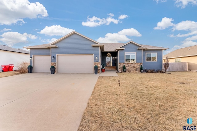 view of front of house with a front yard and a garage