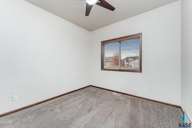 carpeted empty room with ceiling fan