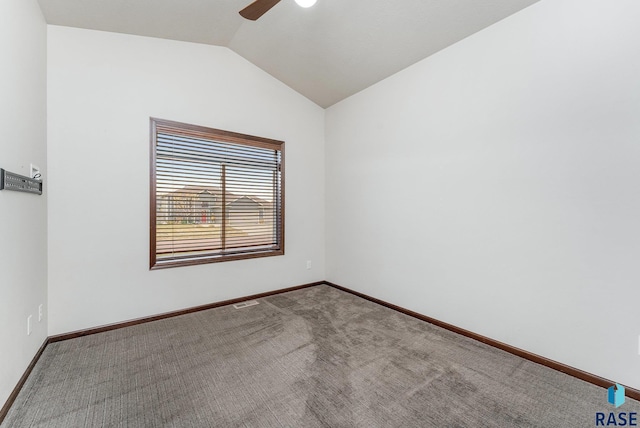 unfurnished room featuring ceiling fan, carpet, and vaulted ceiling