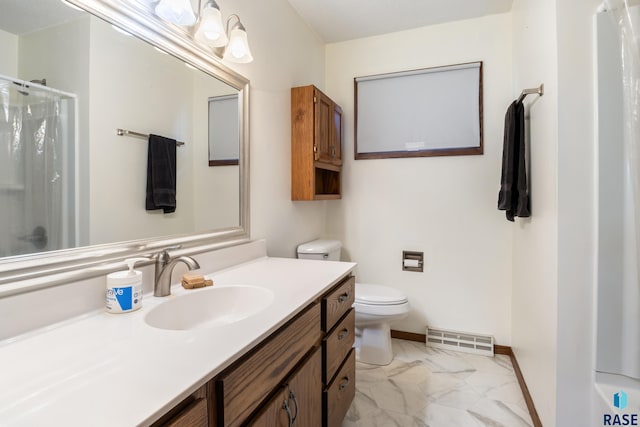 bathroom featuring toilet, vanity, and walk in shower