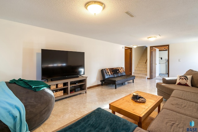 living room with a textured ceiling