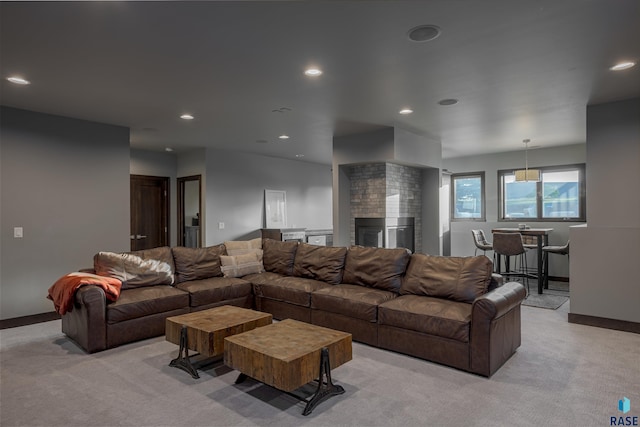 carpeted living room featuring a multi sided fireplace