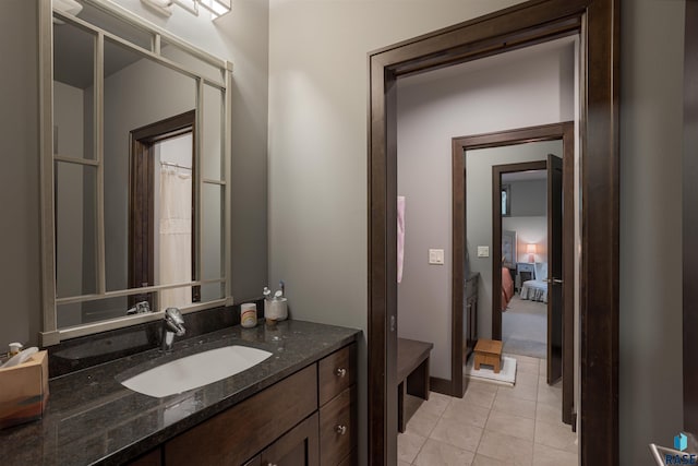 bathroom featuring tile patterned floors and vanity