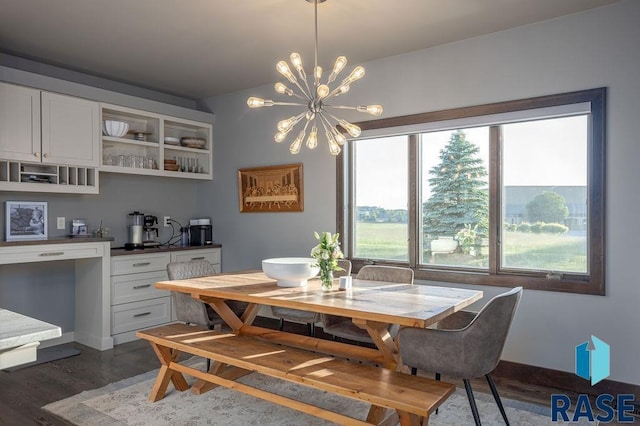 dining room featuring dark wood-type flooring and a notable chandelier