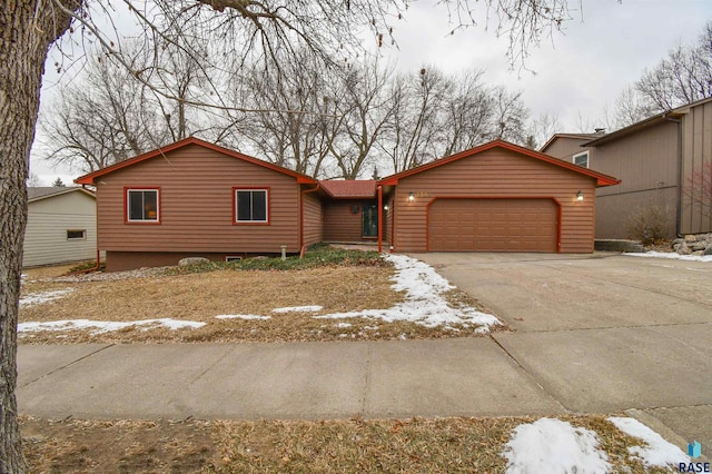 ranch-style home featuring a garage