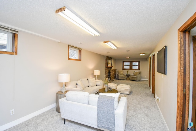 carpeted living room with a textured ceiling