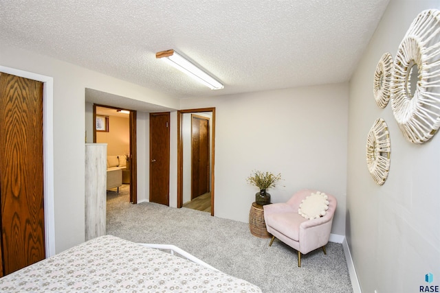 carpeted bedroom with a textured ceiling