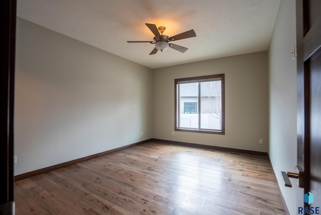 unfurnished room featuring light wood-type flooring and ceiling fan