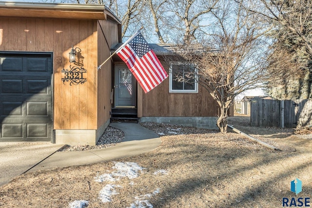 property entrance with a garage