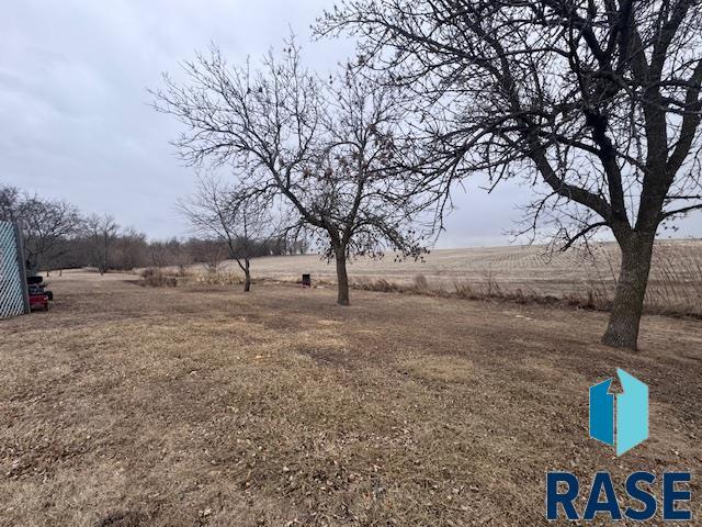 view of yard with a rural view