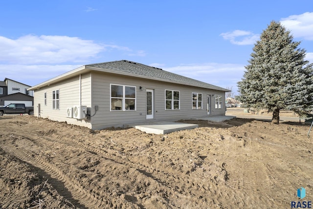 rear view of property with a patio area and ac unit