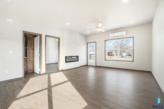 unfurnished living room with ceiling fan, dark hardwood / wood-style floors, heating unit, and an AC wall unit