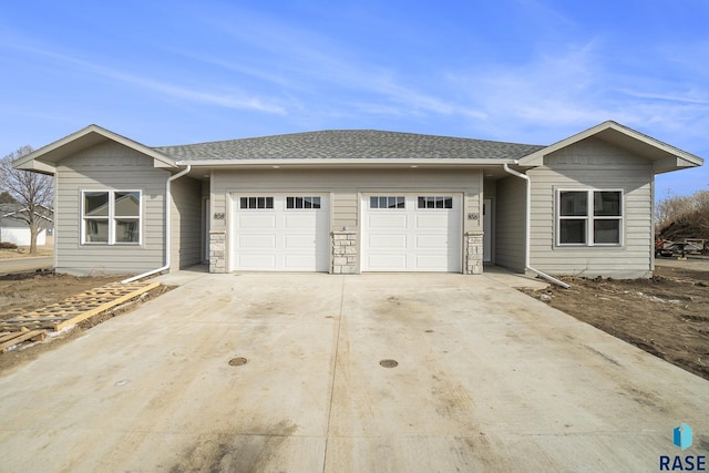 ranch-style home with a garage