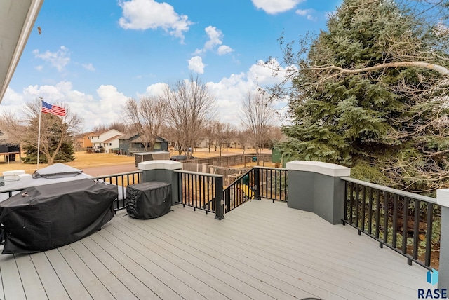 wooden deck featuring grilling area