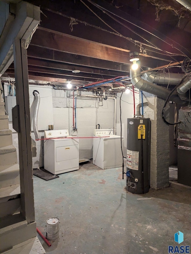 basement featuring gas water heater and washing machine and dryer