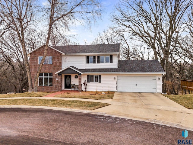 view of front property featuring a garage and a front lawn