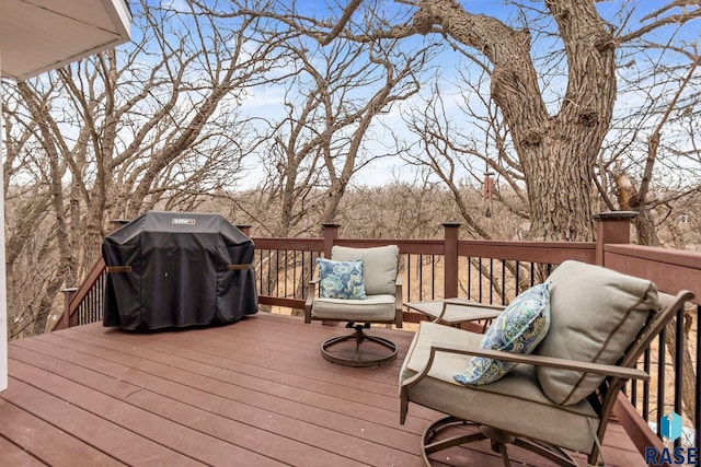 wooden terrace featuring grilling area