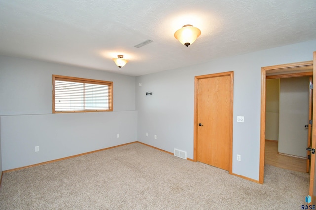 unfurnished bedroom with carpet floors