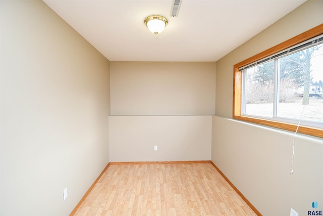 spare room with light wood-type flooring