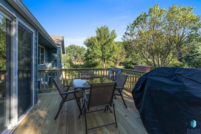 wooden terrace featuring area for grilling