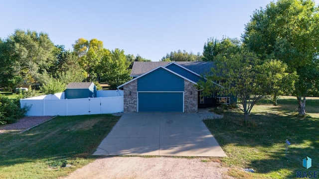 view of front of house with a garage and a front yard