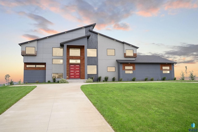 contemporary home with a yard