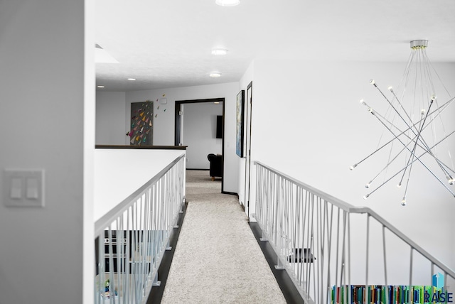 hallway with a notable chandelier