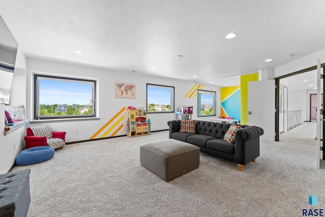 living room with light carpet and a textured ceiling