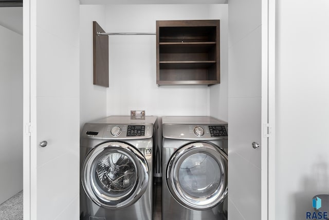 laundry room with washer and dryer