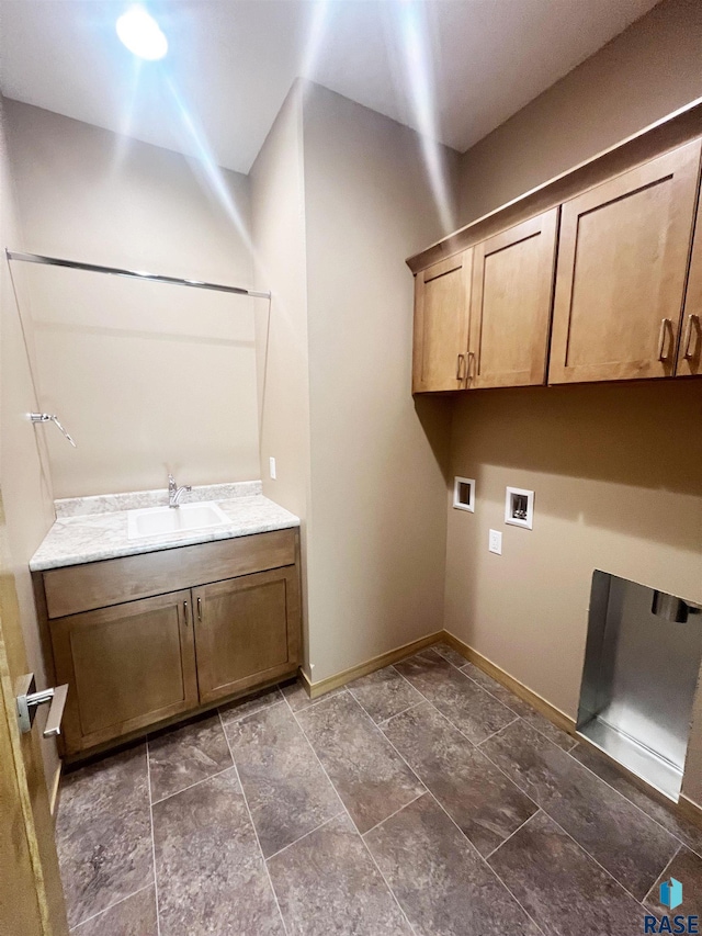 washroom featuring sink, cabinets, and washer hookup