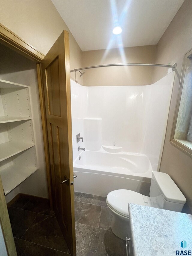 full bathroom with toilet, vanity, and bathing tub / shower combination