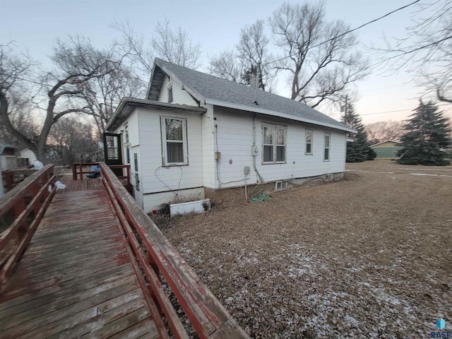 view of property exterior at dusk