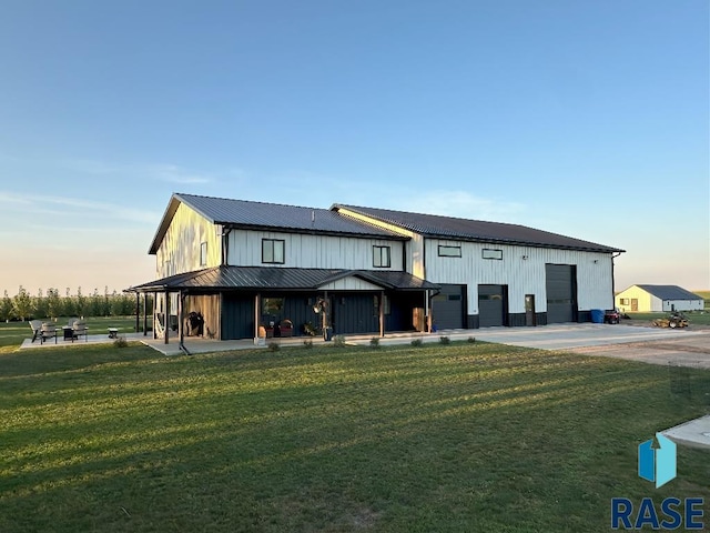 exterior space with a yard and a garage