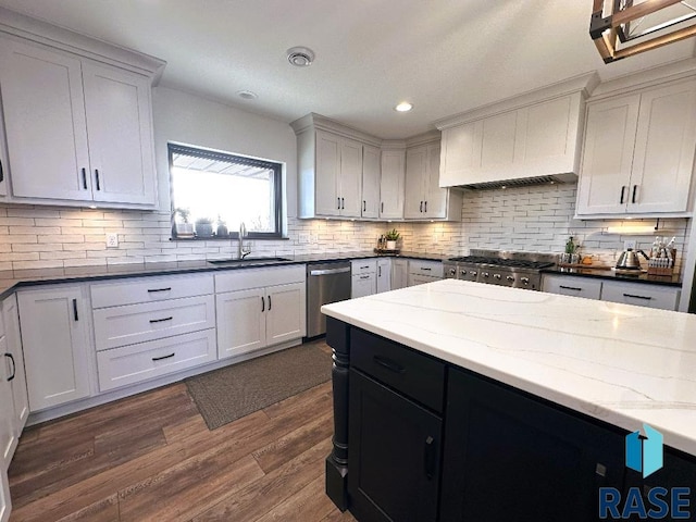 kitchen with dark wood-type flooring, sink, and white cabinets