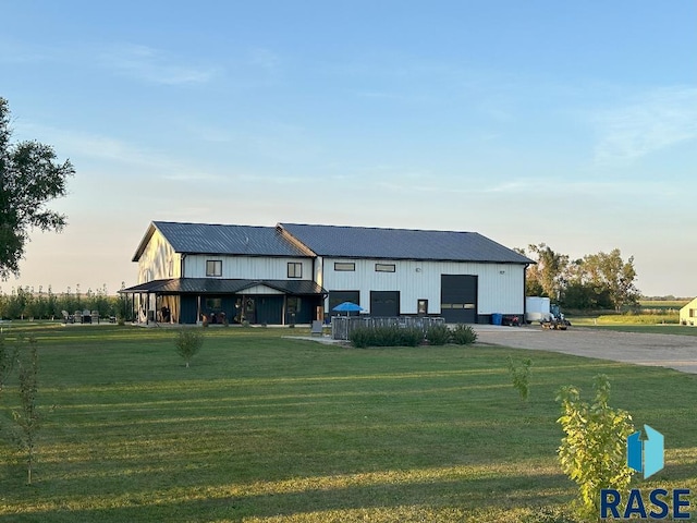 modern farmhouse style home with a garage and a front yard