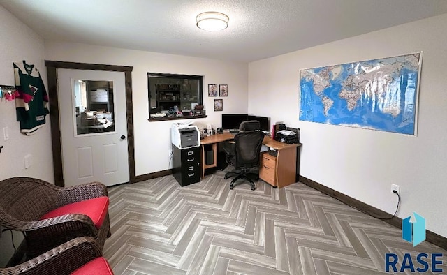 office with a textured ceiling