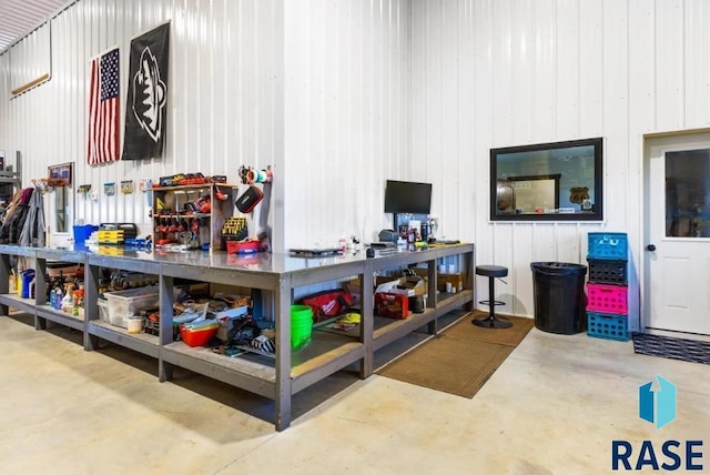 garage featuring wood walls