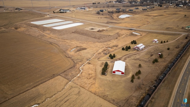 birds eye view of property featuring a rural view