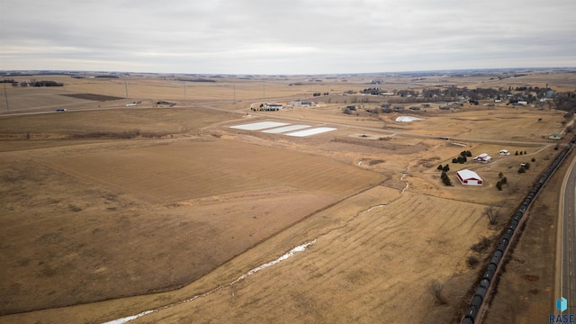 birds eye view of property featuring a rural view