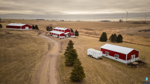 birds eye view of property featuring a rural view