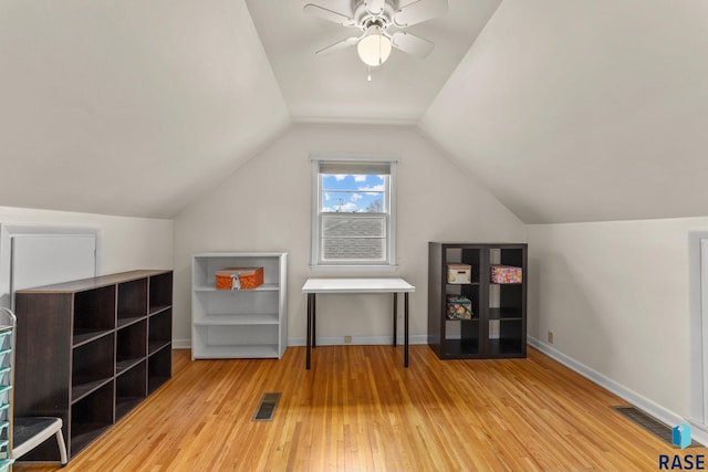 interior space with vaulted ceiling, hardwood / wood-style floors, and ceiling fan