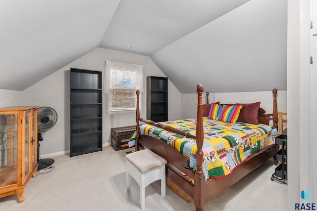 carpeted bedroom featuring vaulted ceiling