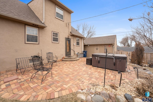 view of patio / terrace with a hot tub