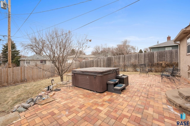 view of patio with a hot tub