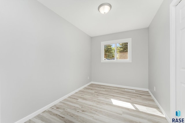 spare room with light hardwood / wood-style flooring