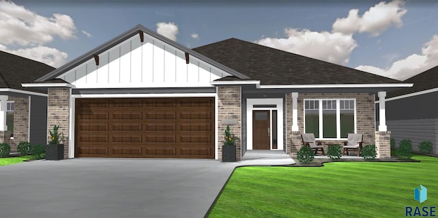 view of front of property with a garage, covered porch, and a front lawn