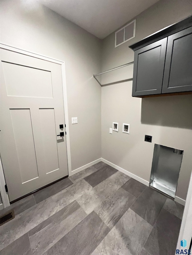 laundry area featuring washer hookup, visible vents, cabinet space, hookup for an electric dryer, and baseboards